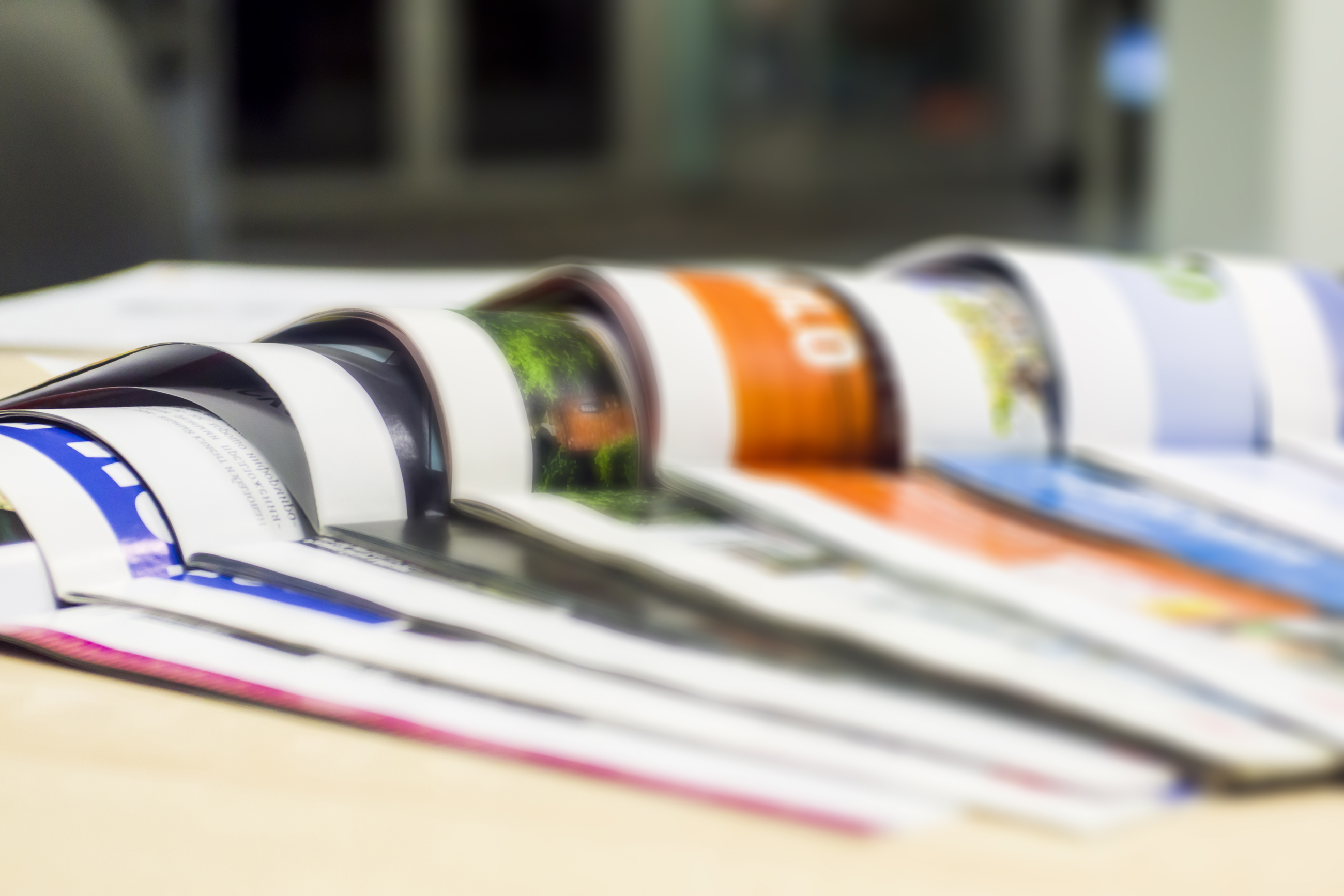 Photograph of stacked magazine print journals